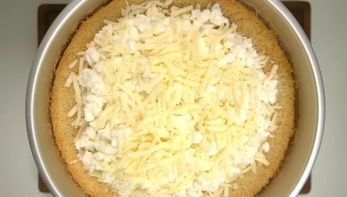 Bake for another 15-20 minutes until the cheese is fully melted. If water pools, remove, dab with paper towels, and add some extra kunafa to absorb it.