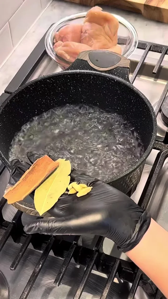 Boil chicken breast in salted water with cardamom, bay leaf, and cinnamon stick.