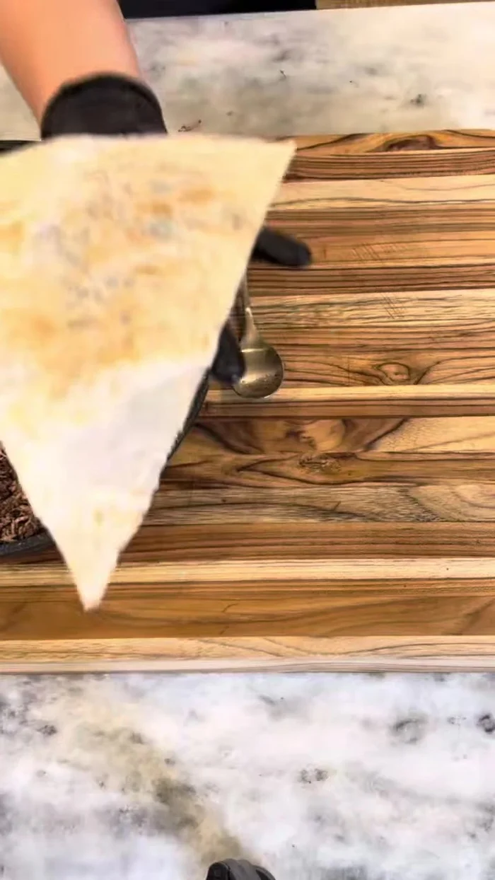 Cut bread into triangles.