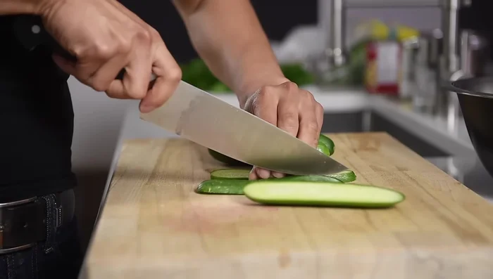 Combine ingredients: Add the chickpeas, cucumbers, parsley, and mint to the large mixing bowl.