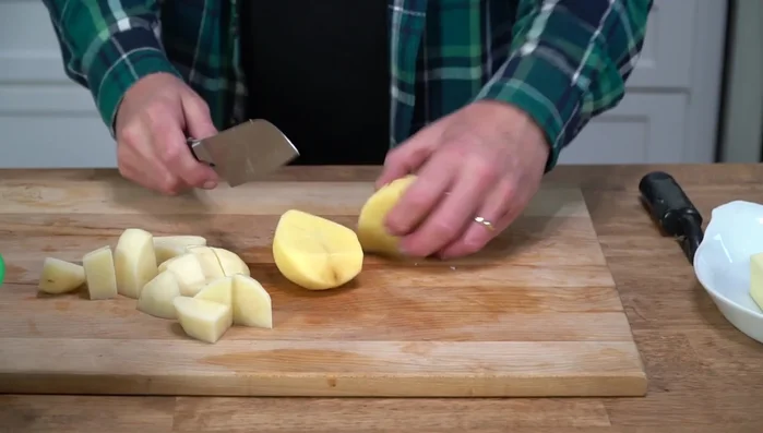 Prepare potatoes: Peel and cut potatoes into large chunks. Immediately place them in cold water to prevent browning (138.16).