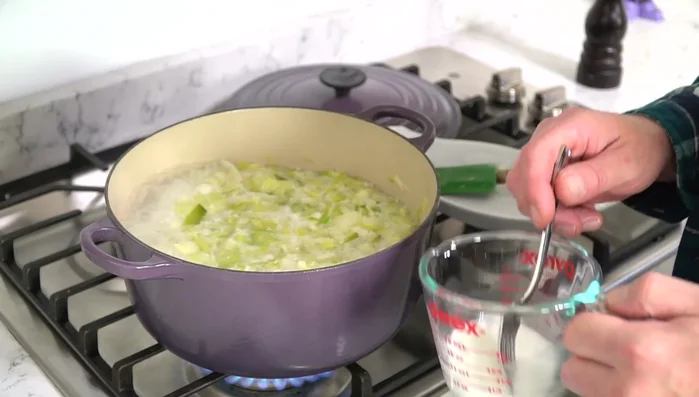Once boiling, add cornstarch slurry and stir for 10-15 seconds until thickened (308.629).