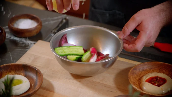 Prepare the Pita Bread: brush with olive oil and sprinkle with sea salt.