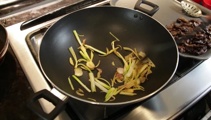Add julienned ginger and sauté.