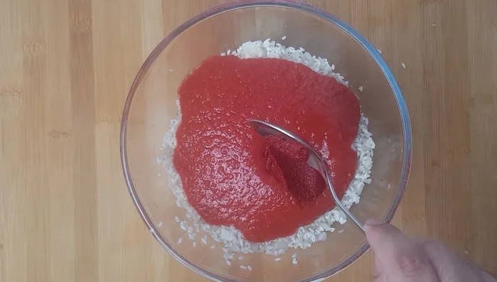 Add crushed tomatoes (blend fresh or canned tomatoes if needed) and 3 tbsp tomato puree to the rice mixture. Mix thoroughly. Taste and adjust seasoning.
