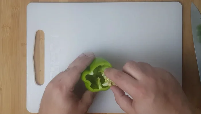Cut tops off peppers. Clean peppers by removing seeds and white flesh.