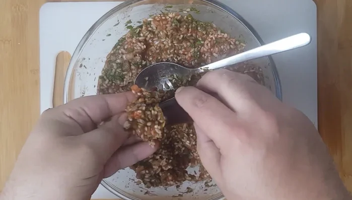 Spoon or push the rice mixture into aubergines and peppers, filling them about ½ cm from the top.