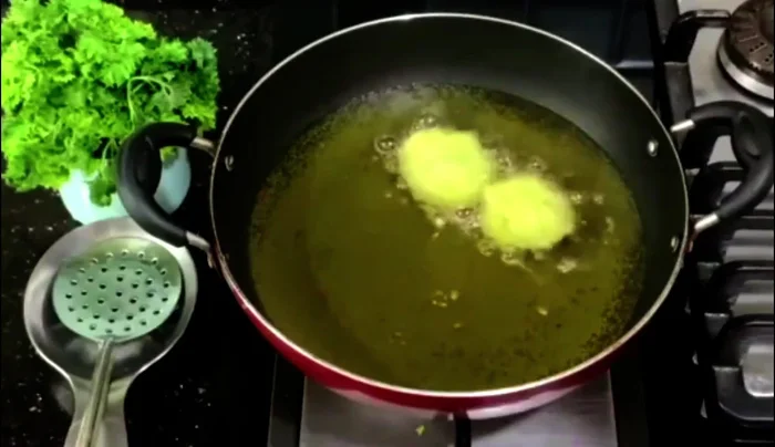Carefully drop the falafel into hot oil. Reduce heat, turn frequently, and fry until golden brown.