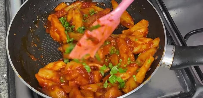 Stir in fresh coriander leaves and simmer for 1 minute before removing from heat.
