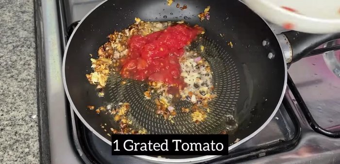 Add tomato puree (from 1 tomato) and cook until softened.