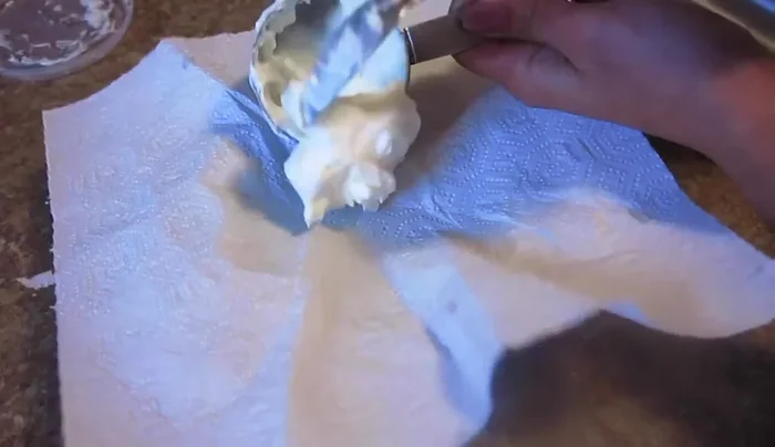Strain ½ cup of nonfat Greek yogurt for about 20 minutes to thicken it.