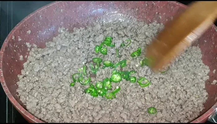 Add finely diced onions, green chilies, and cook for another 8 minutes until onions are softened.