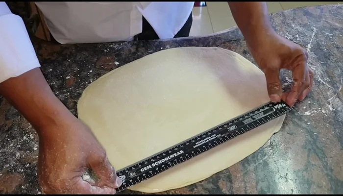 Cut the layered roti into 6cm wide strips.