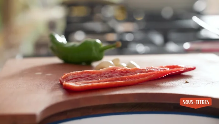 Chop vegetables: Finely chop the green pepper, red pepper, and garlic.