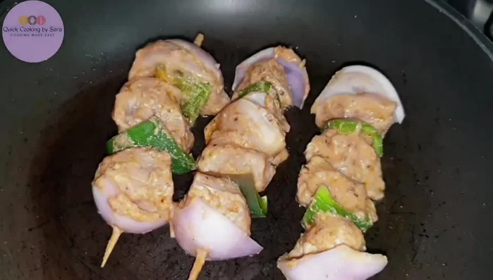 Heat oil in a frying pan and fry the skewers, turning them frequently until they are browned and cooked through (about 8-10 minutes).