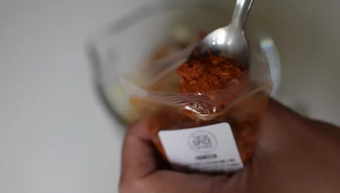 Add harissa spice blend and blitz everything together to make the marinade.
