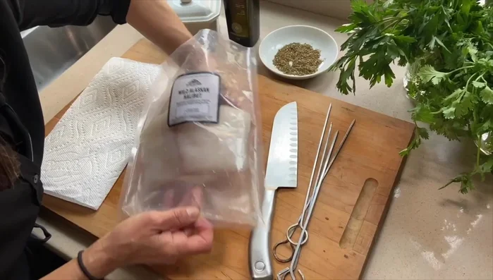 Pat the halibut dry and cut it into large cubes.