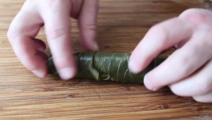 Prepare the grape leaves: Unroll and separate the jarred grape leaves. Rinse them thoroughly under cold water to remove the brine and soak in cold water for 10-15 minutes to reduce brininess.