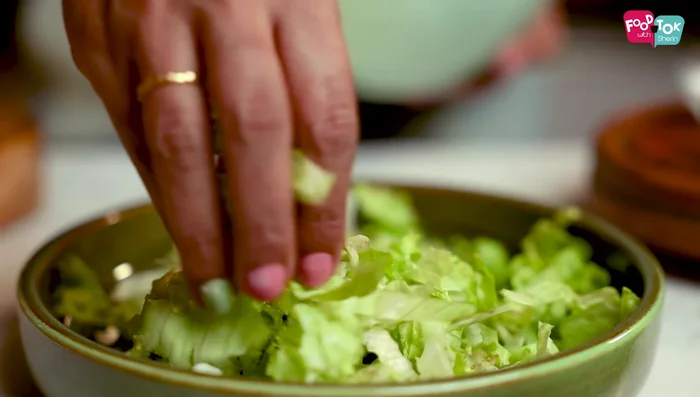 Assemble the salad: On a serving plate, add salad greens. Place the sliced chicken in the center. Arrange grilled pineapple and red bell pepper on either side.