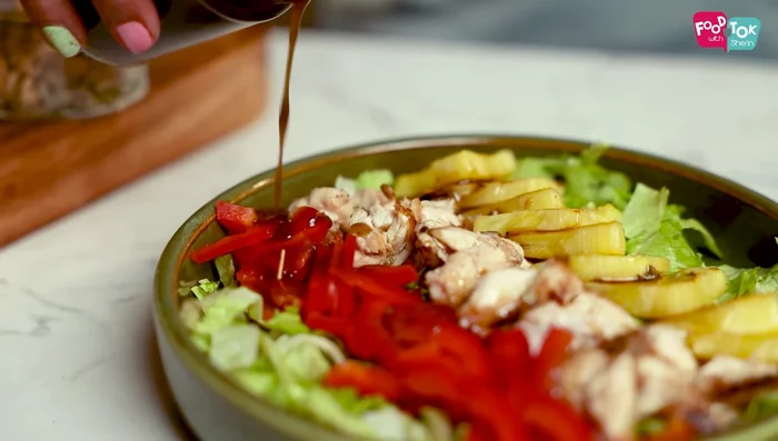 Dress and garnish: Pour the balsamic vinaigrette dressing over the salad. Garnish with mixed nuts and seeds.