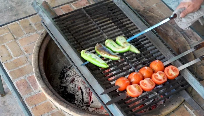 Place the skewers on the grill and cook until fully cooked and slightly charred, brushing occasionally with butter.