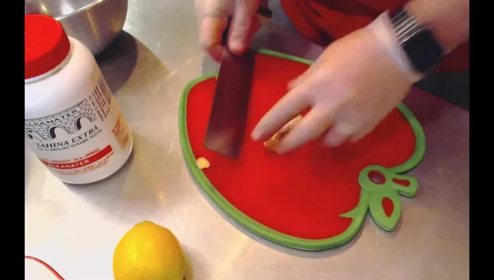 Slice ginger and garlic. Prepare green onions, reserving some for garnish. (29.46)