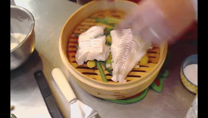 Once the fish is cooked, spoon the toum sauce generously over the fish. Garnish with remaining green onions and cilantro (optional). (457.02)