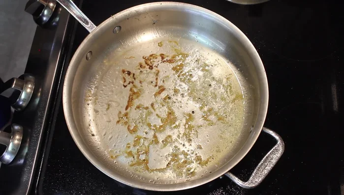 Set aside the cooked chicken. Brown the remaining chicken in the same pan.