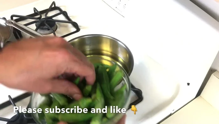 Deep-fry the frozen okra in small batches until golden brown (approximately 3-4 minutes per batch). This removes the slimy texture.