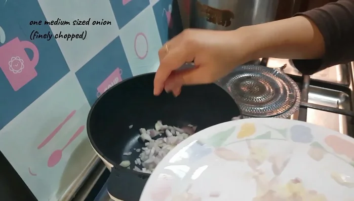 In a separate pot, sauté diced onion in 3 tablespoons of olive oil (5 minutes) until translucent.