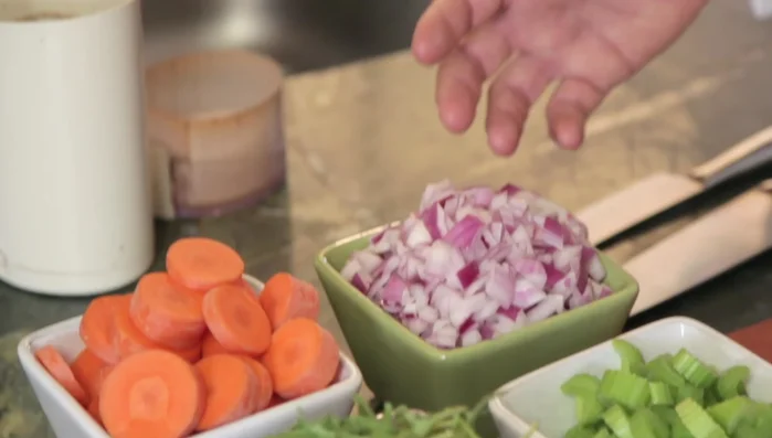 Prepare the vegetables: Chop onions, carrots, parsnips, celery, and mushrooms.