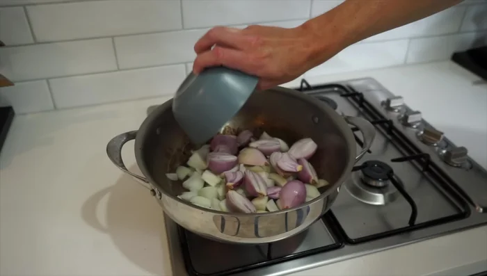 Sauté onions and shallots: Add chopped onions and shallots to the same pan and sauté for about 3 minutes.