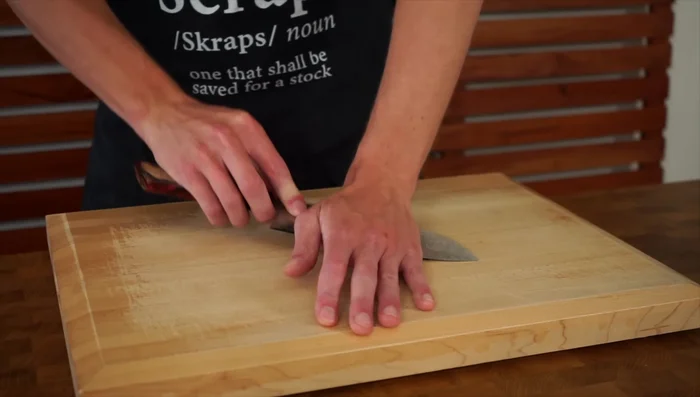 Crush and chop the garlic: Use the side of a knife to crush garlic cloves and roughly chop.