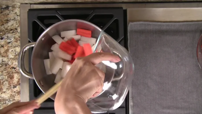 In a medium pot, add the vegetables and chicken stock. Bring to a boil, then reduce heat to low and cook for 7-8 minutes.