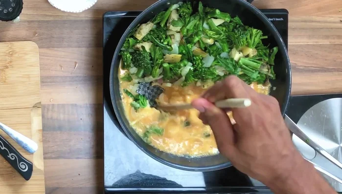 Once the eggs start to set, use a wooden spoon to gently fold and finish cooking. Remove from heat once it's slightly creamy to prevent overcooking.