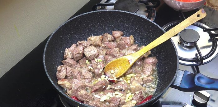 Add garlic, salt, black pepper, onion, cumin powder, and green cardamom powder. Cook for another 5-6 minutes, stirring frequently.