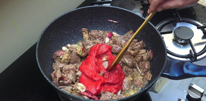 Stir in tomato paste and cook for about 5 minutes, stirring often, until the oil starts to separate.