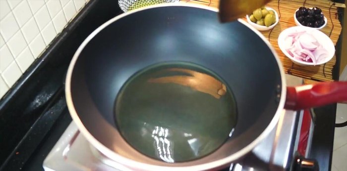 Heat olive oil in a pot or pan. Add sliced onions and chopped garlic. Cook for a few minutes.
