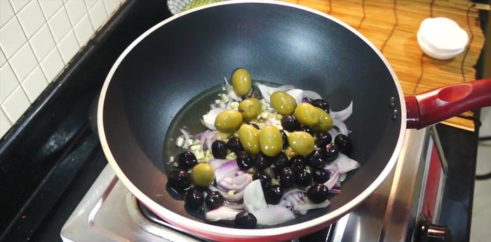 Add olives, smoked paprika, oregano, and thyme. Cook for about 3 minutes.