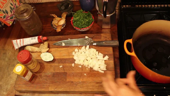 While the vegetables are roasting, chop fresh ginger and crush garlic.