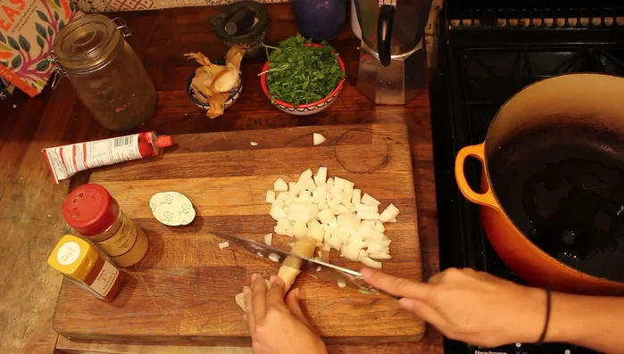 Heat oil in a pot over medium heat. Sauté the onions until slightly colored.