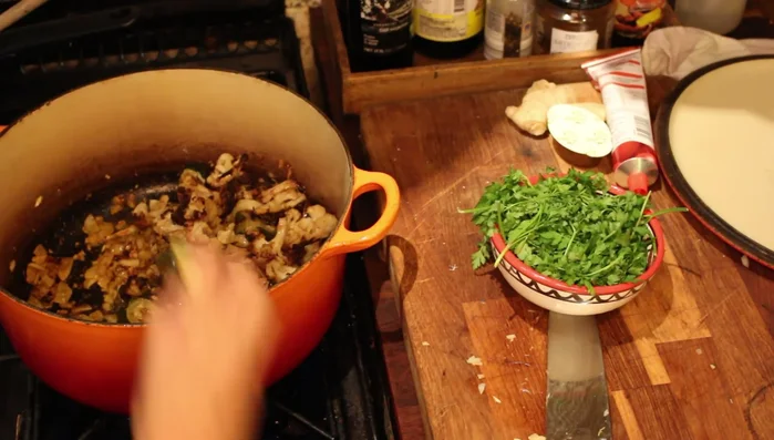 Add the roasted vegetables to the pot and mix well.