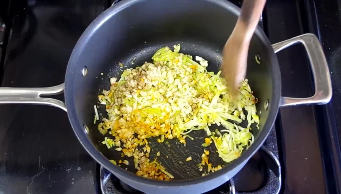 Add minced garlic and spices; stir well and cook until fragrant (about 1 minute).