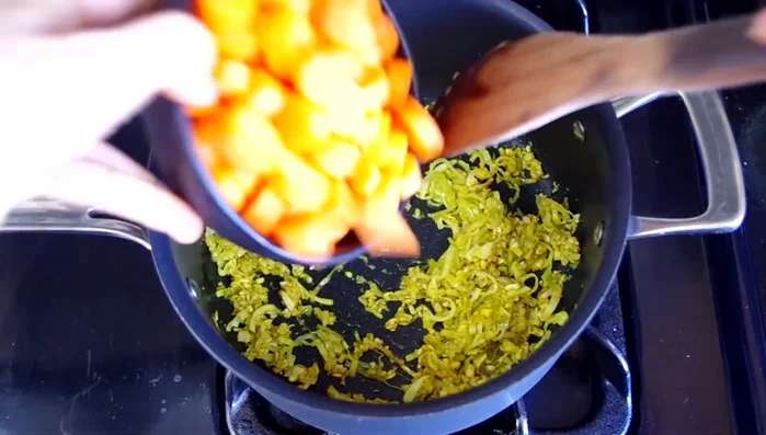 Add carrots, stir to coat, and cook for 3 minutes.
