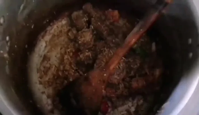 Fill the pressure cooker about halfway with boiled water (avoid overfilling).