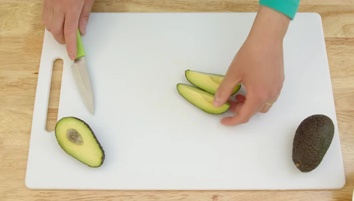 Prepare the remaining ingredients: Chop parsley and mint leaves. (To prevent browning, coat avocado with lemon juice before adding to the salad.)