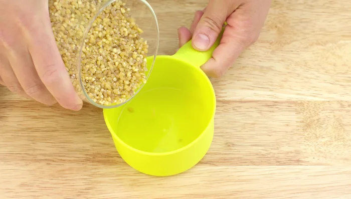 Prepare the bulgur. The water-to-bulgur ratio is 1 1/4 cups water/stock to 1 cup bulgur. Use the same container to measure both.