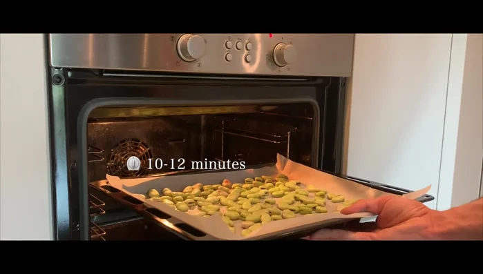 Roast the beans in the preheated oven for 10-12 minutes per side, or until the skin is nicely charred, flipping halfway through.