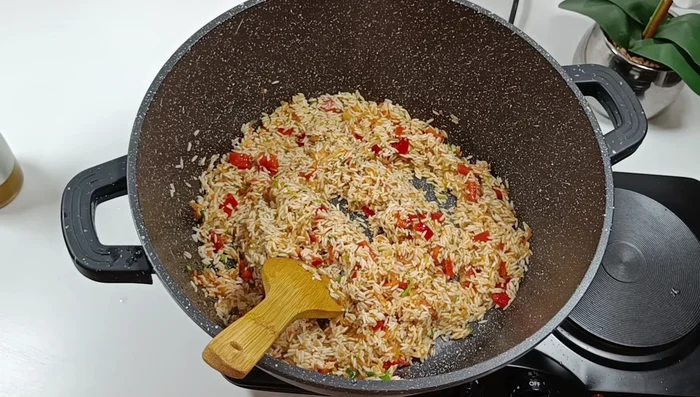 Add water and saffron (optional): Add water and saffron (if using) to the rice. Cook for 10-15 minutes, or until rice is cooked through. Adjust cooking time based on your rice type.