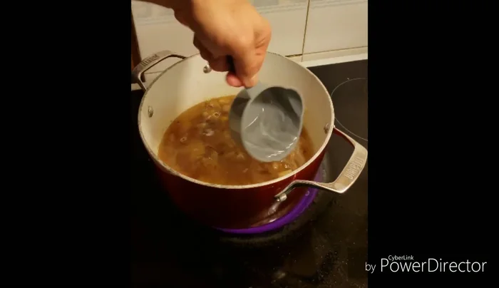 Add boiling water, turmeric, white pepper, and pre-soaked basmati rice to the pan.